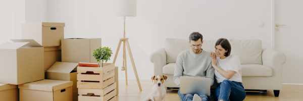 A couple with dog moving home 